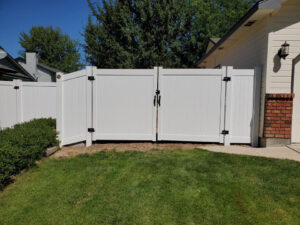 Beautiful property with stunning white vinyl fence and gate